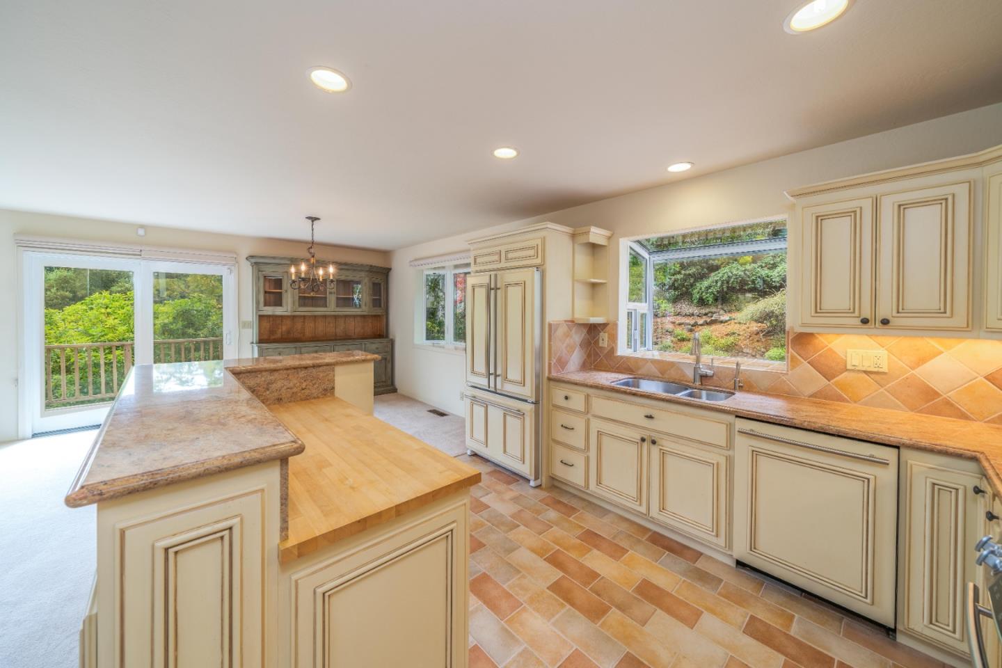 533 La Honda Drive Aptos, CA 95003 - Photo 15 of 44 a kitchen with stainless steel appliances granite countertop a sink and cabinets