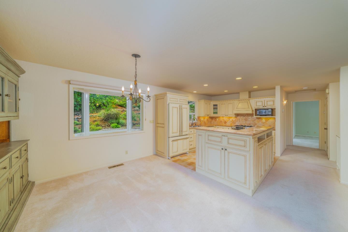 533 La Honda Drive Aptos, CA 95003 - Photo 22 of 44 a open kitchen with white cabinets and white appliances