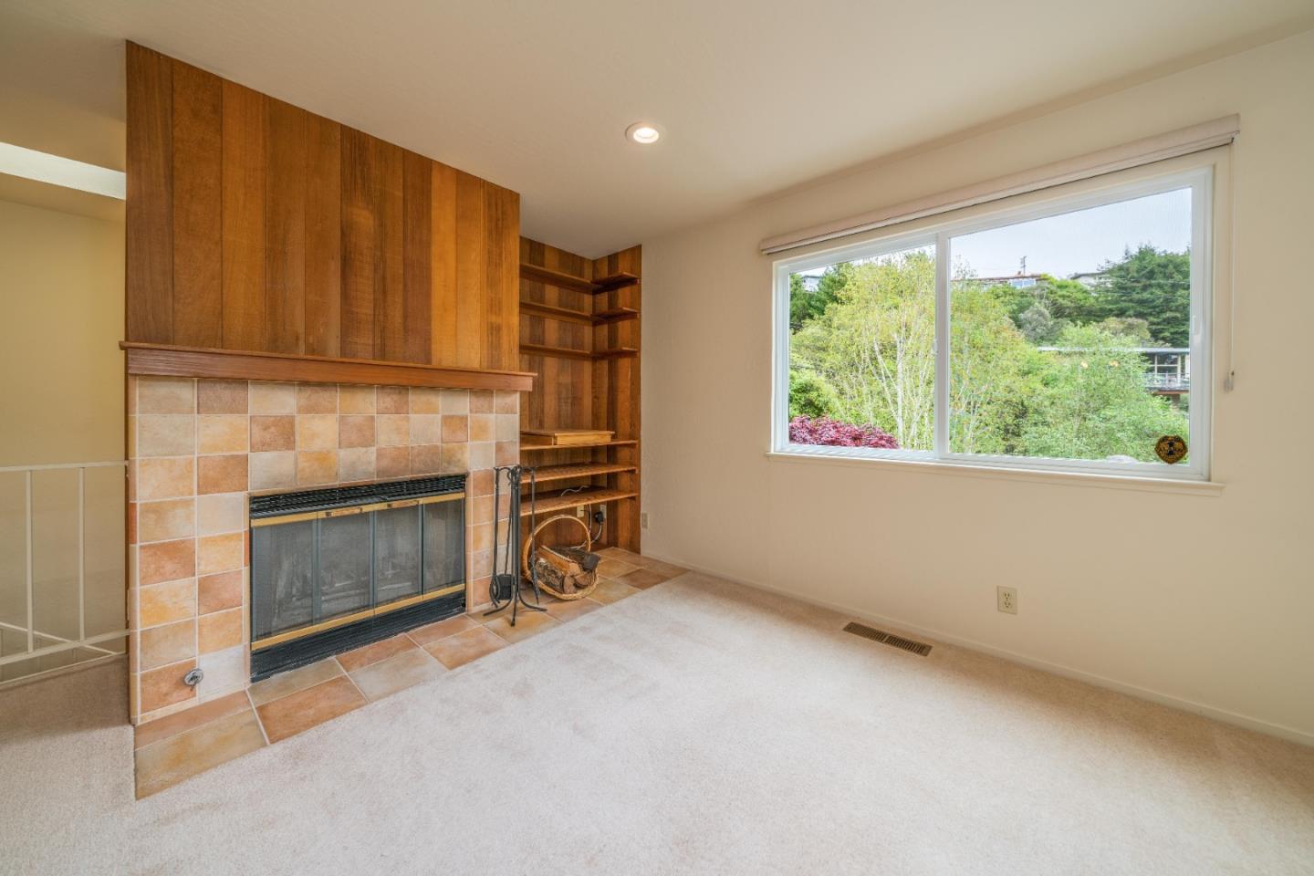 533 La Honda Drive Aptos, CA 95003 - Photo 24 of 44 an empty room with windows and fireplace
