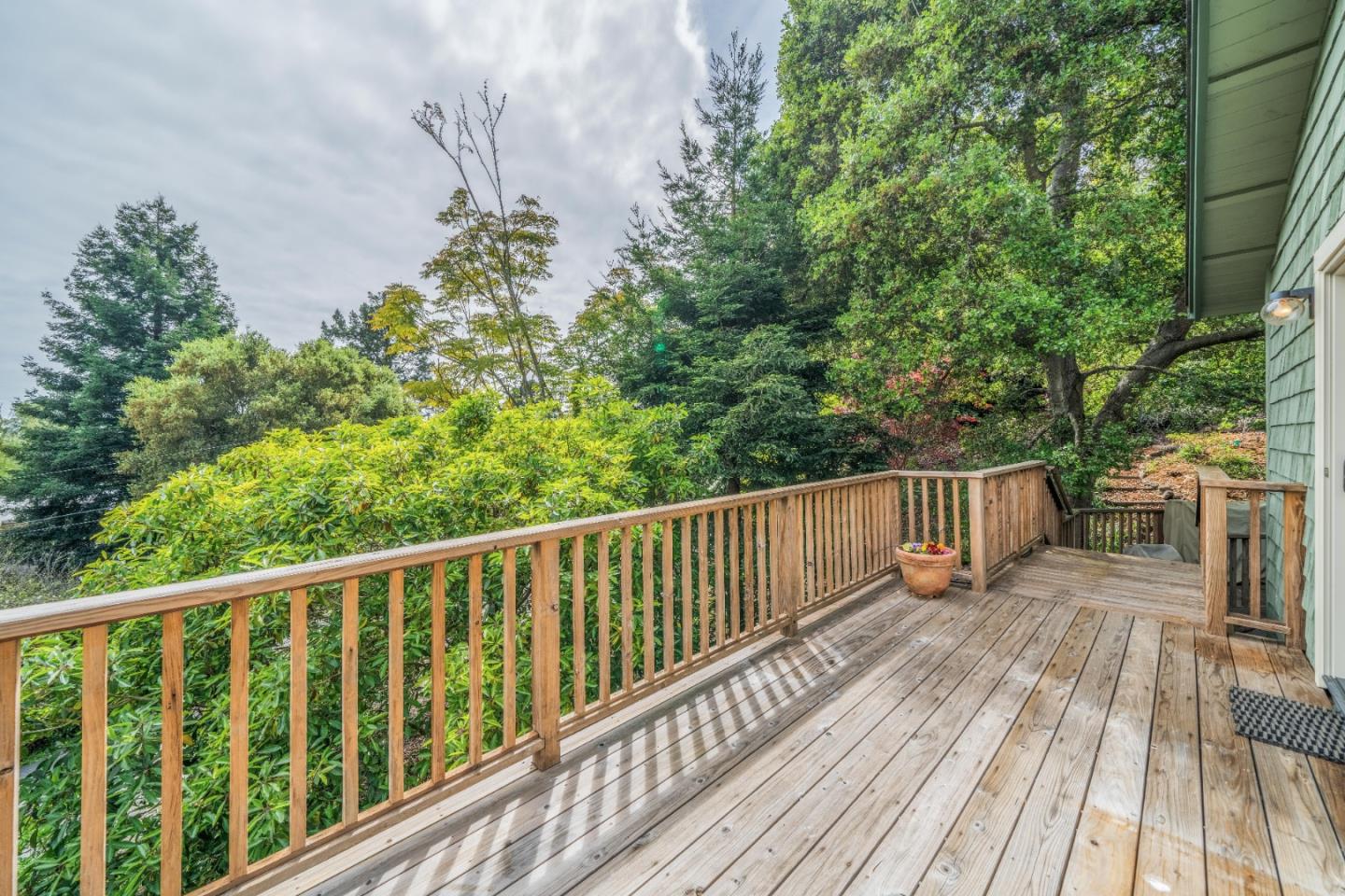 533 La Honda Drive Aptos, CA 95003 - Photo 26 of 44 a balcony with wooden floor and trees