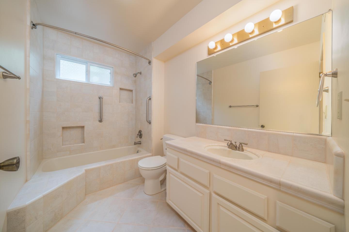533 La Honda Drive Aptos, CA 95003 - Photo 41 of 44 a bathroom with a double vanity sink toilet mirror and bathtub