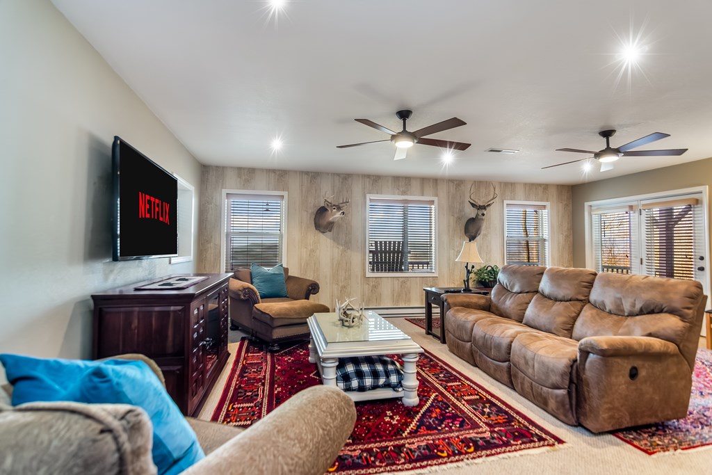62 Trophy Buck Point Murphy, NC 28906 - Photo 28 of 46 a living room with furniture ceiling fan and a flat screen tv