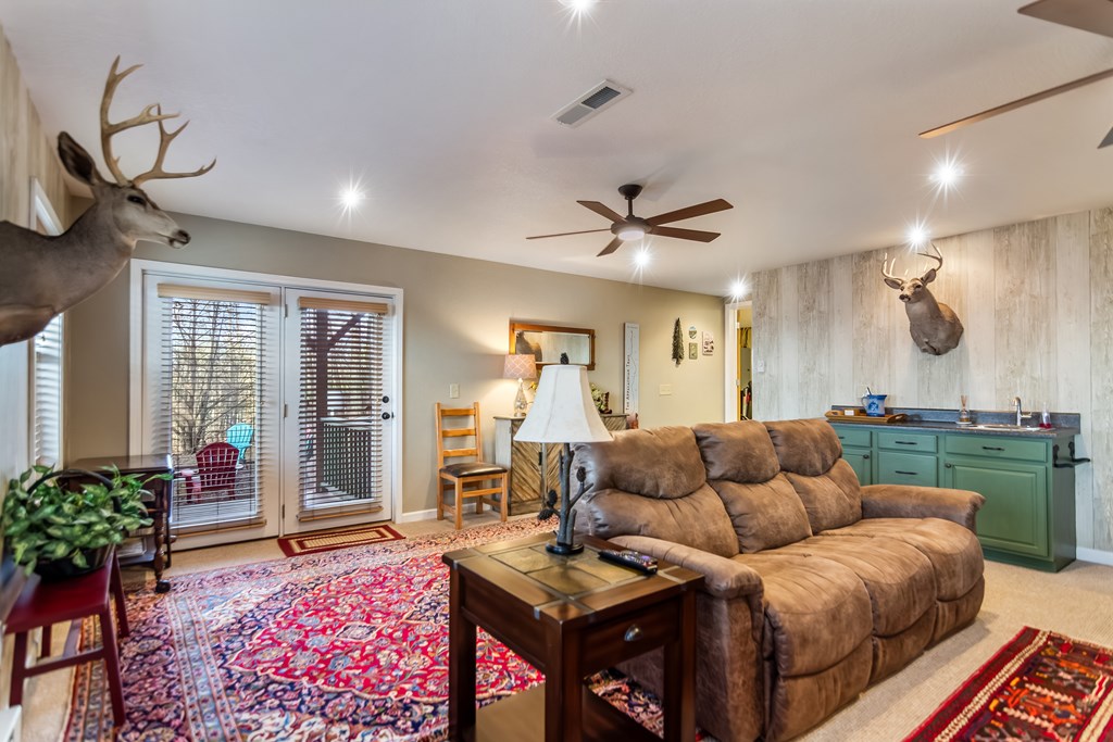 62 Trophy Buck Point Murphy, NC 28906 - Photo 29 of 46 a living room with furniture a chandelier and a table