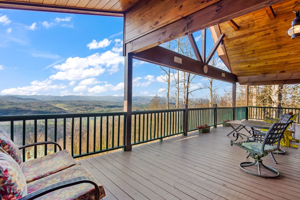 62 Trophy Buck Point Murphy, NC 28906 - Photo 6 of 46 a balcony with wooden floor table and chairs