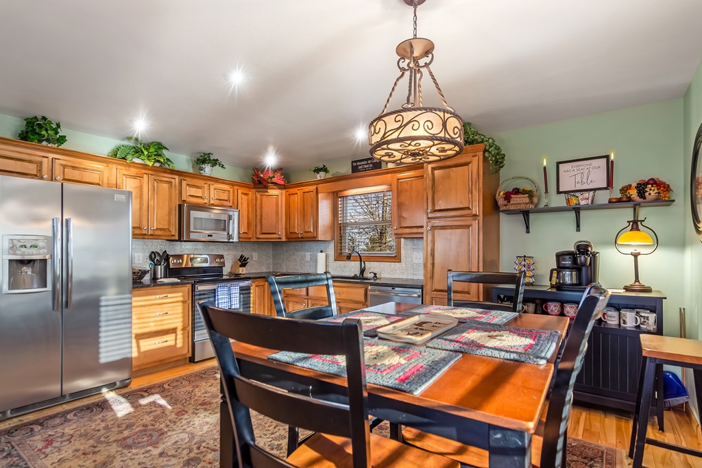 62 Trophy Buck Point Murphy, NC 28906 - Photo 8 of 46 a dining room with furniture a chandelier and wooden floor