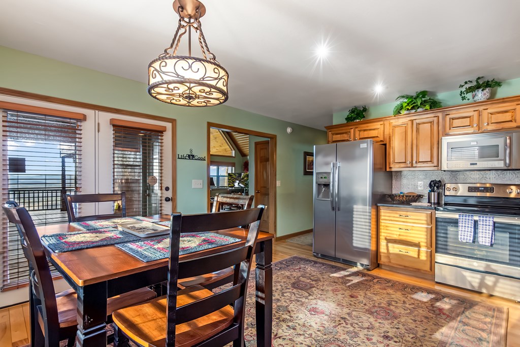 62 Trophy Buck Point Murphy, NC 28906 - Photo 9 of 46 a view of a dining room with furniture window and wooden floor