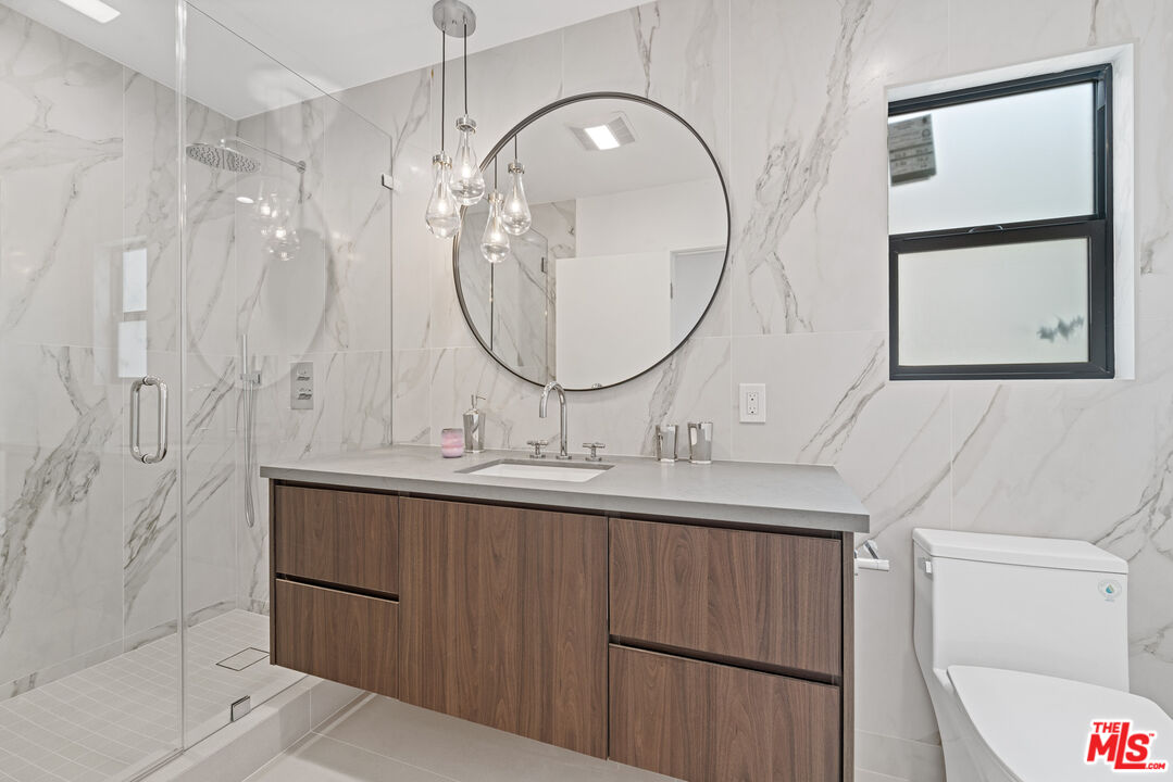 3305 Ocean Front Walk, Unit 2 Marina del Rey, CA 90292 - Photo 13 of 23 a bathroom with a sink and a mirror