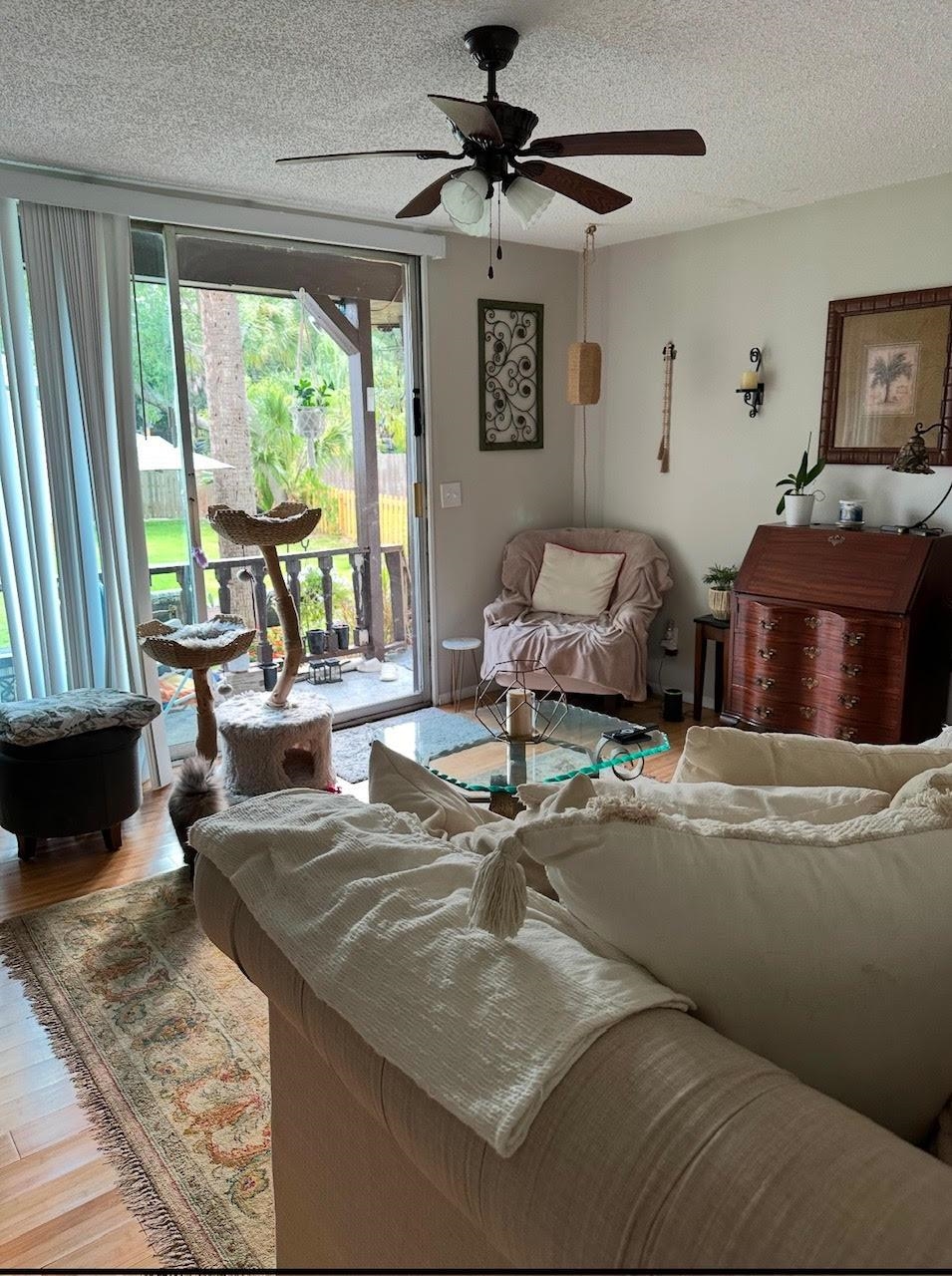 34 Arenta Street, Unit C St. Augustine, FL 32084 - Photo 6 of 9 a living room with furniture and a window