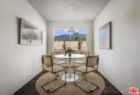 a spacious bedroom with a bed and a window