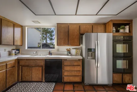 a bathroom with a sink a vanity and a mirror