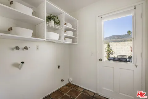 a bed room with a bed and a window