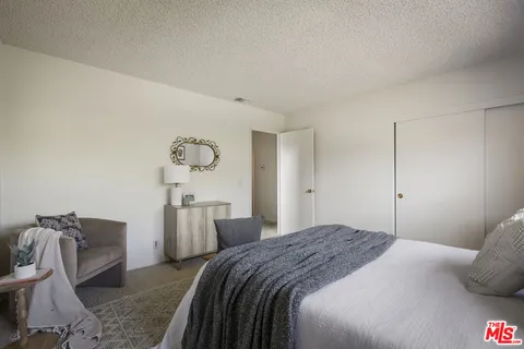 a view of a patio with table and chairs and potted plants