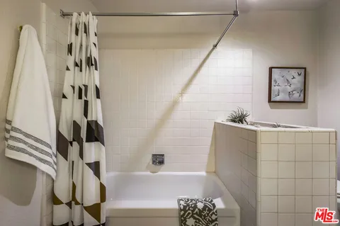 a view of backyard of house with green space