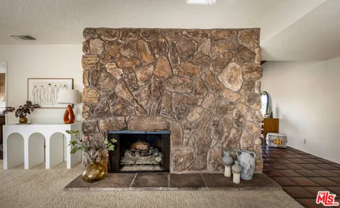 a living room with furniture and a rug