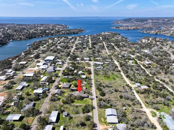 an aerial view of residential building and lake