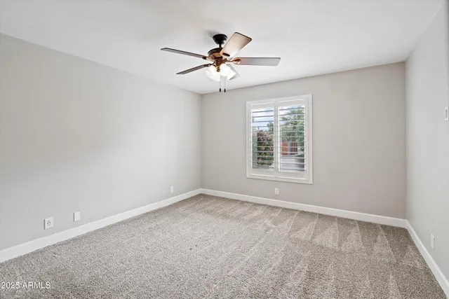 a bathroom with a toilet a sink a tub and mirror