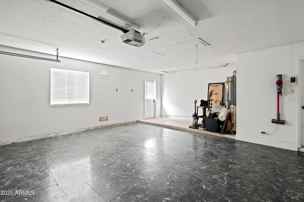a view of a patio with table and chairs a barbeque with potted plants