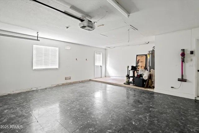 a view of a patio with table and chairs a barbeque with potted plants