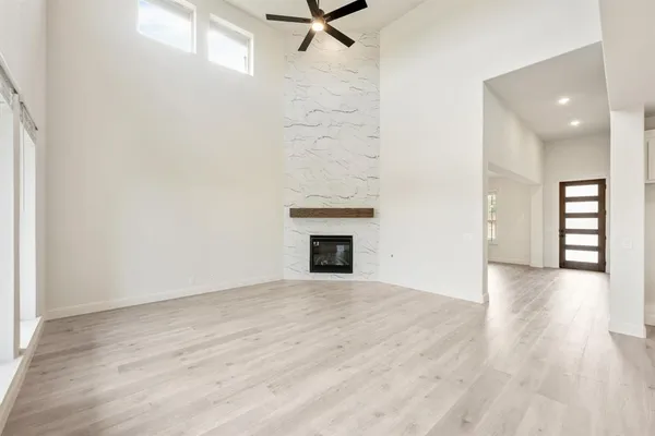 a white bath tub sitting next to a shower