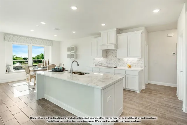 a kitchen with stainless steel appliances granite countertop a sink stove and cabinets