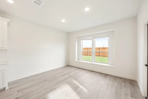 a bathroom with a granite countertop sink a toilet and bathtub
