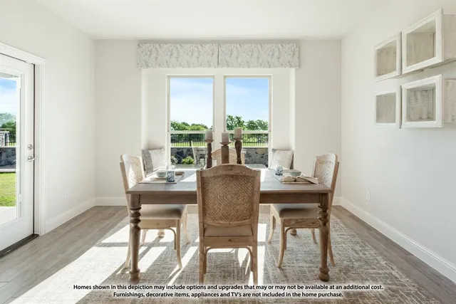 a dining room with furniture and wooden floor