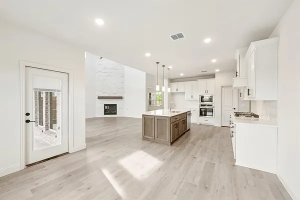 a view of a house with backyard and porch