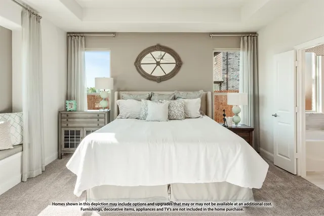 a large white bed in a white room
