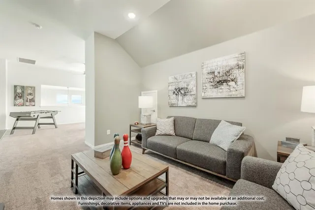 a living room with furniture and painting on the wall