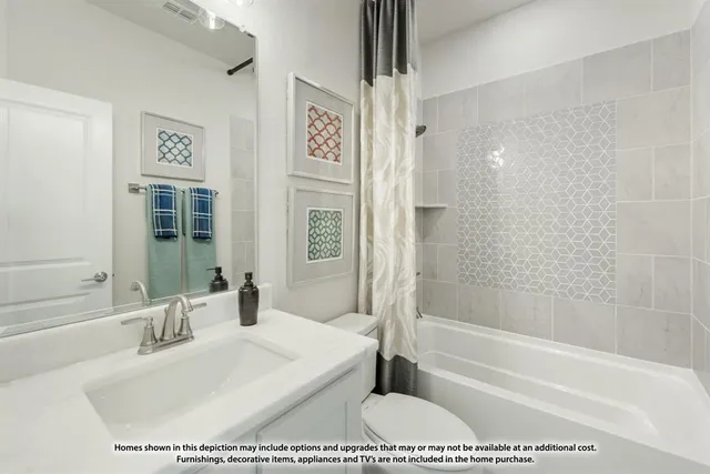 a bathroom with a bathtub a shower and a sink