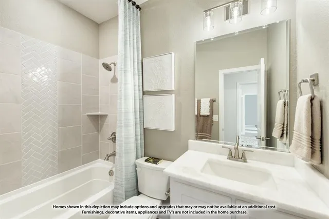 a bathroom with a tub a sink and a large mirror