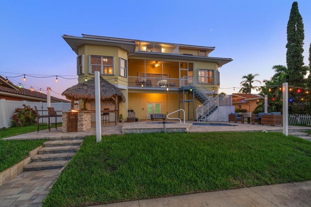 3339 Seaway Drive New Port Richey, FL 34652 - Photo 16 of 48 a front view of a house with a yard table and chairs