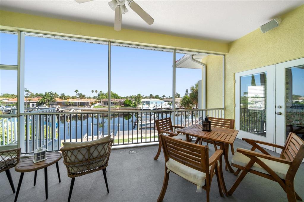 3339 Seaway Drive New Port Richey, FL 34652 - Photo 20 of 48 a view of a balcony with chairs and wooden floor