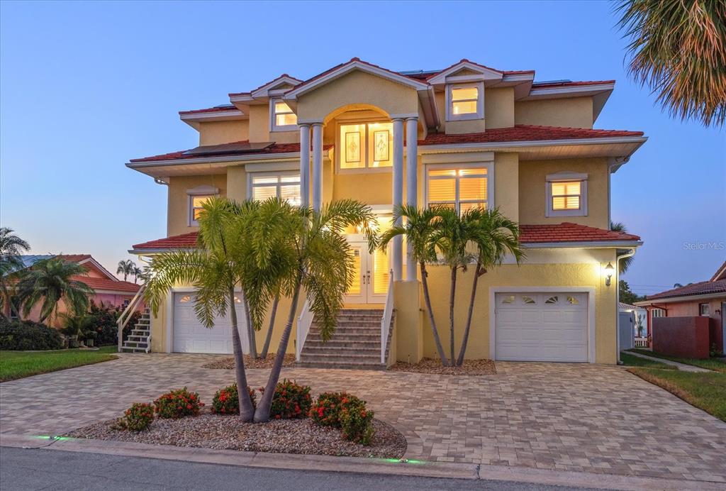 3339 Seaway Drive New Port Richey, FL 34652 - Photo 2 of 48 a front view of a house with garden