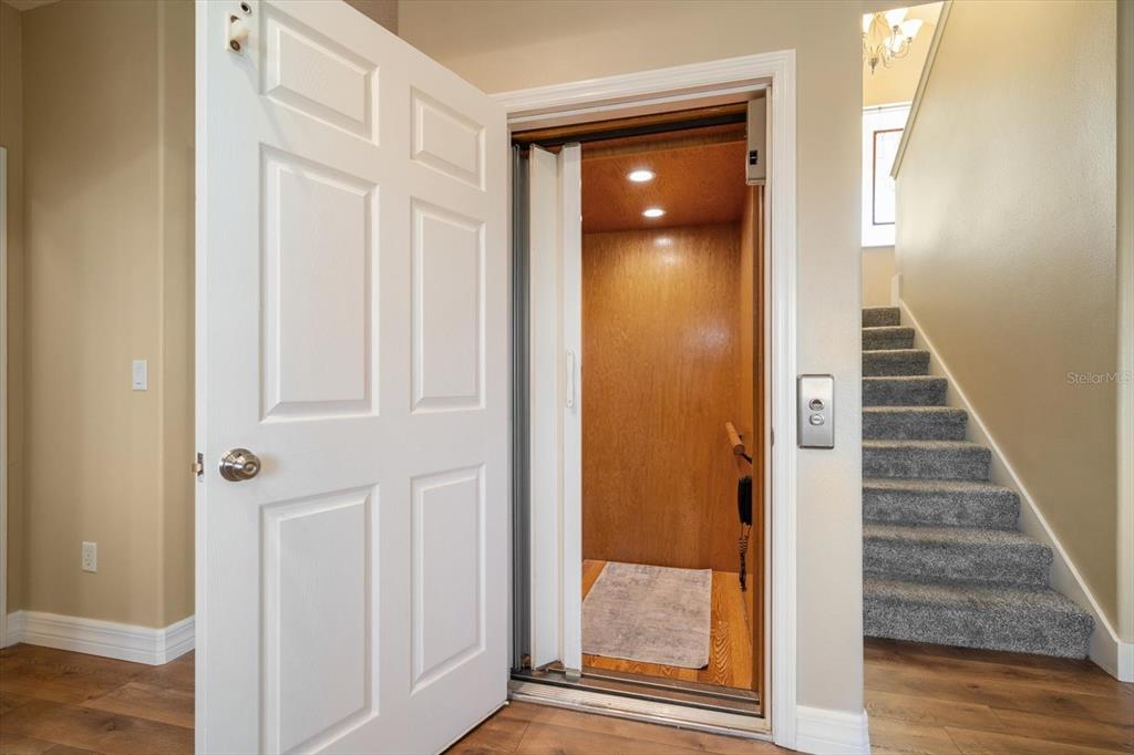 3339 Seaway Drive New Port Richey, FL 34652 - Photo 26 of 48 a view of a hallway with wooden floor and entryway