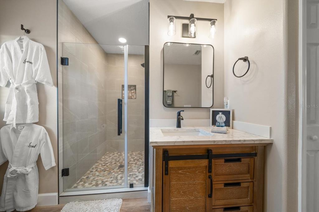 3339 Seaway Drive New Port Richey, FL 34652 - Photo 37 of 48 a bathroom with a sink vanity and a mirror