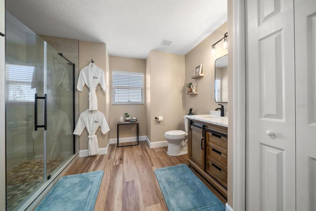 3339 Seaway Drive New Port Richey, FL 34652 - Photo 39 of 48 a spacious bathroom with a sink and a mirror