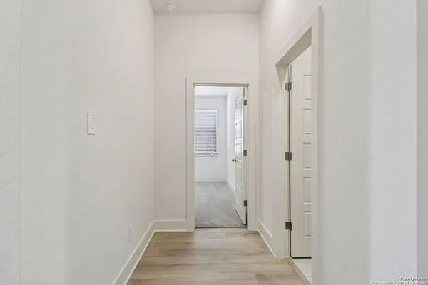 a view of a bathroom from a hallway
