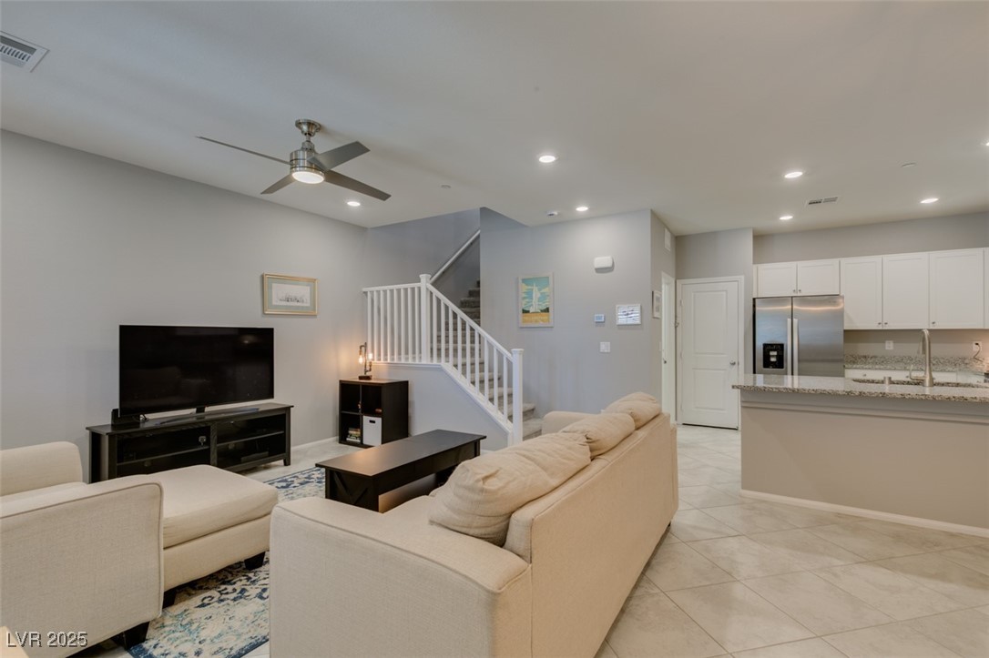 2870 Turnstone Ridge Street Henderson, NV 89044 - Photo 5 of 50 Living room featuring stairway, recessed lighting, a ceiling fan, and light tile patterned floors