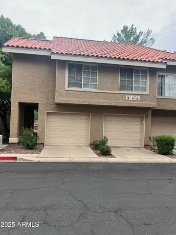 a front view of a house with garage