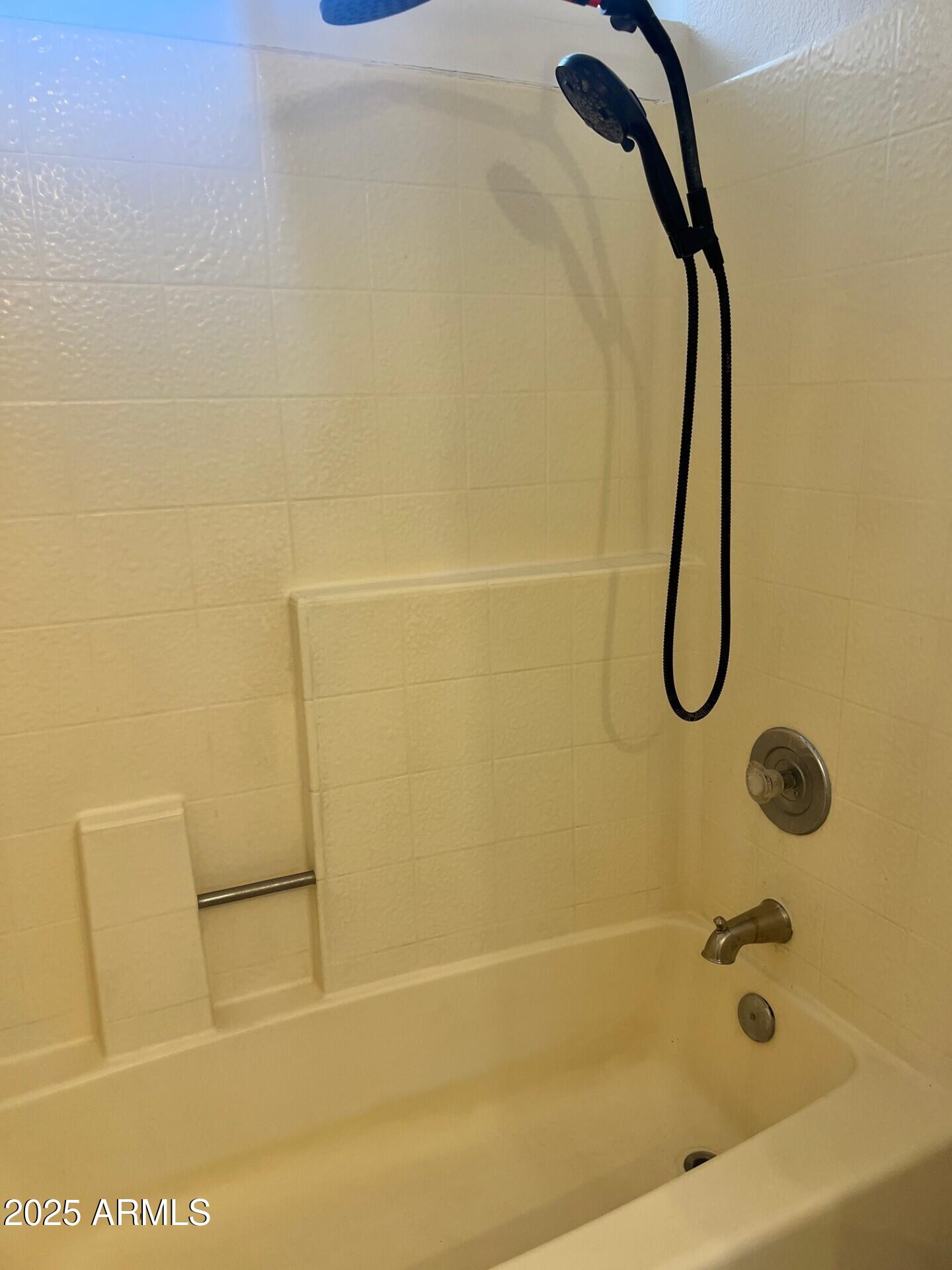 1633 East Lakeside Drive, Unit 17 Gilbert, AZ 85234 - Photo 11 of 19 a bathroom with a shower