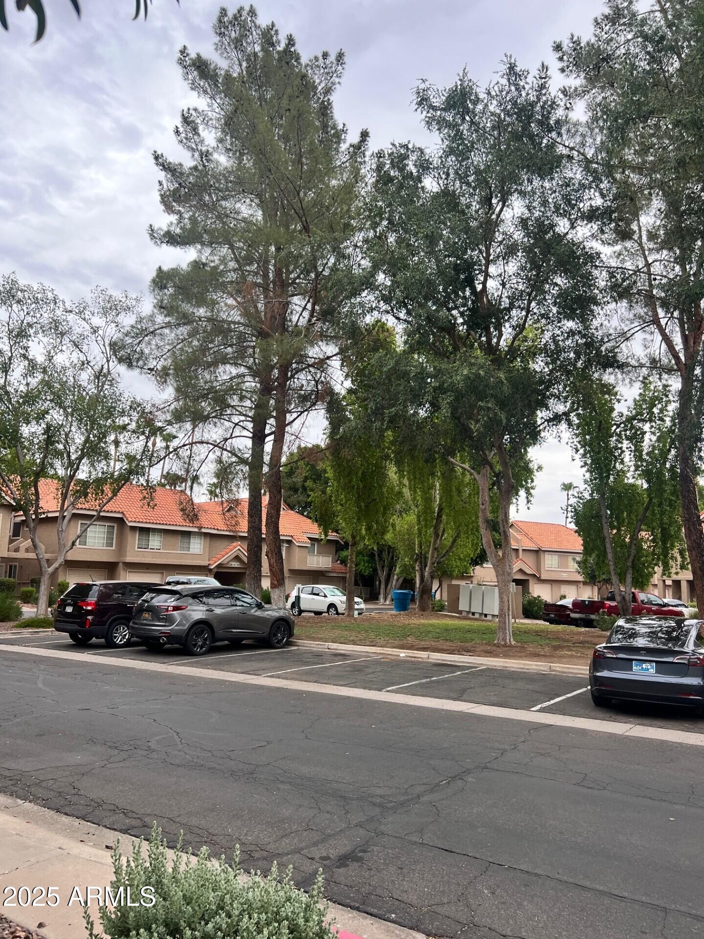 1633 East Lakeside Drive, Unit 17 Gilbert, AZ 85234 - Photo 17 of 19 a car parked on the side of a street