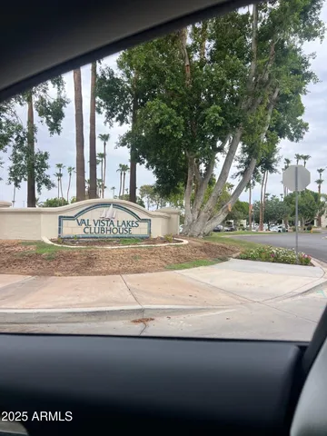 a view of a street with a large trees