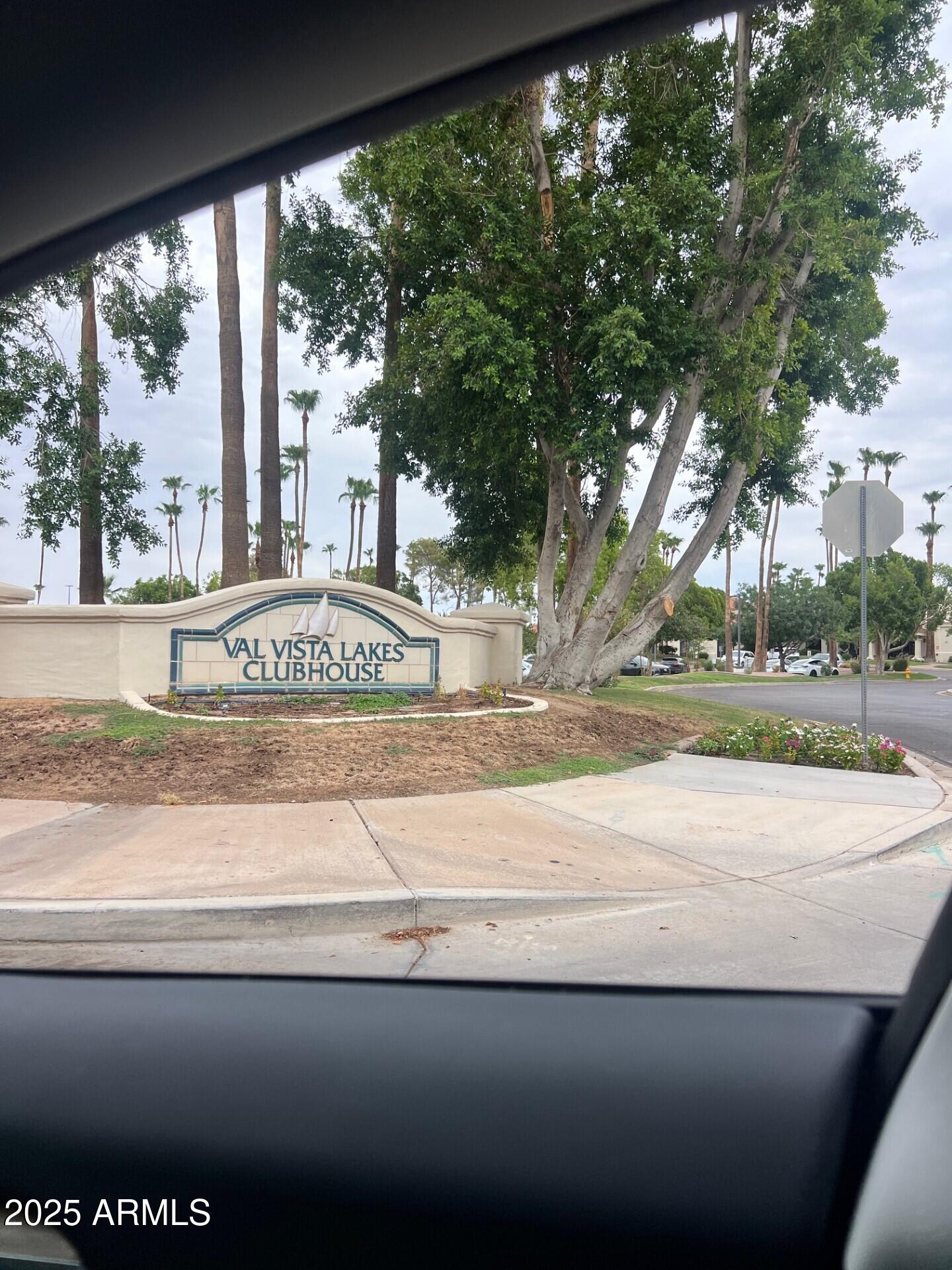 1633 East Lakeside Drive, Unit 17 Gilbert, AZ 85234 - Photo 19 of 19 a view of a street with a large trees