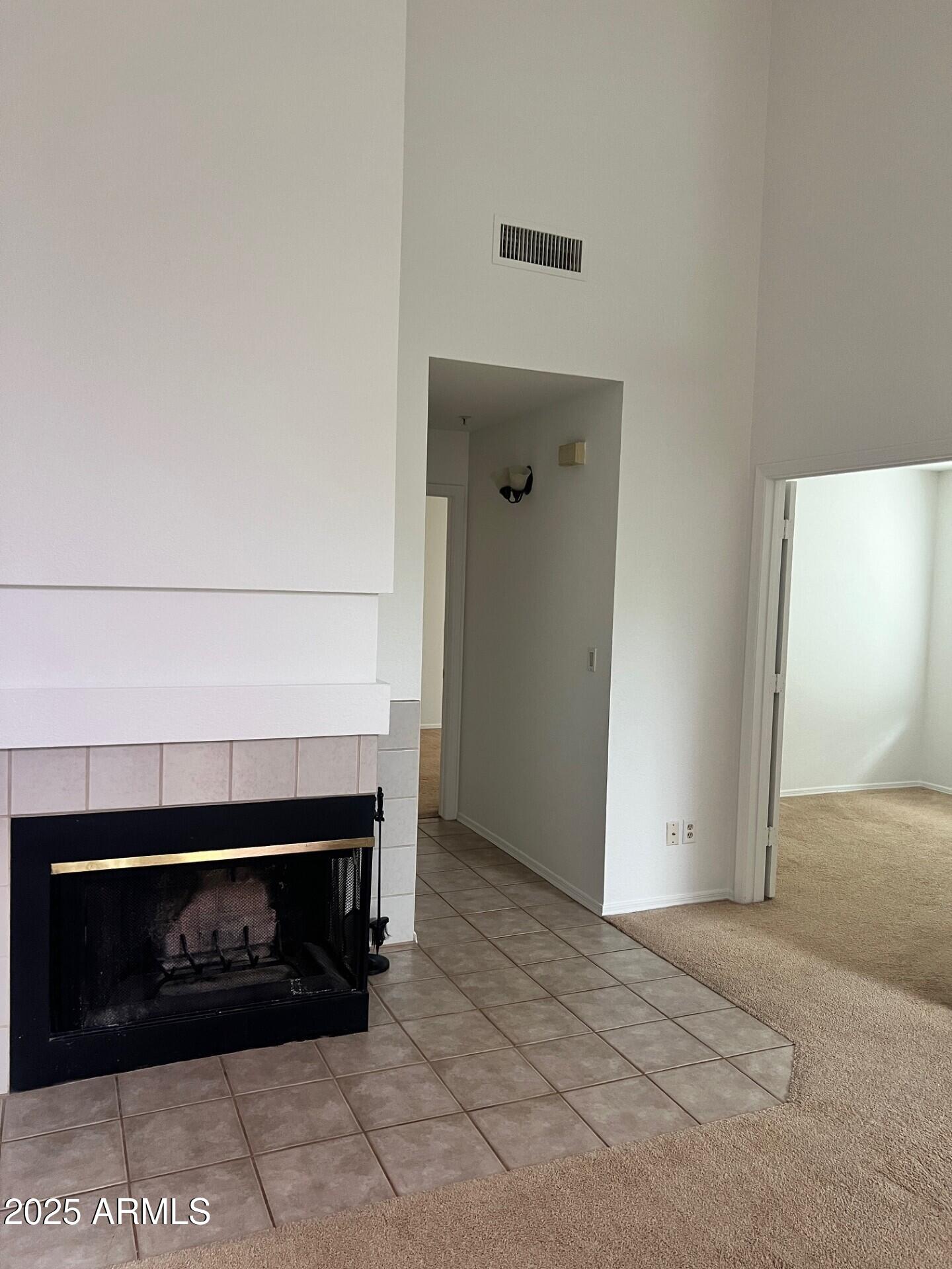 1633 East Lakeside Drive, Unit 17 Gilbert, AZ 85234 - Photo 6 of 19 a living room with a fireplace