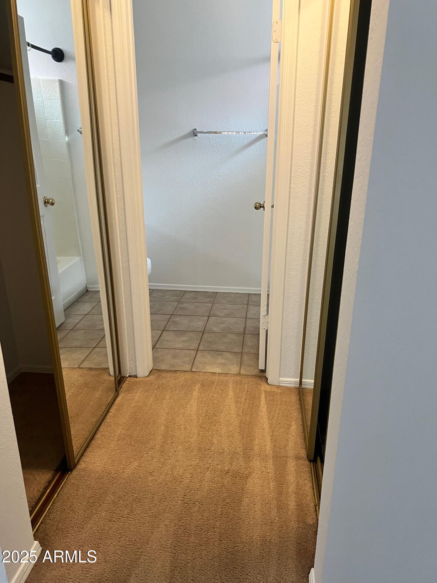 1633 East Lakeside Drive, Unit 17 Gilbert, AZ 85234 - Photo 9 of 19 an empty room with windows