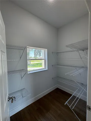 a spacious bathroom with a double vanity sink and a mirror