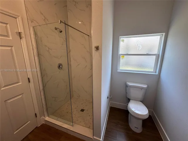a bathroom with double sink and a mirror