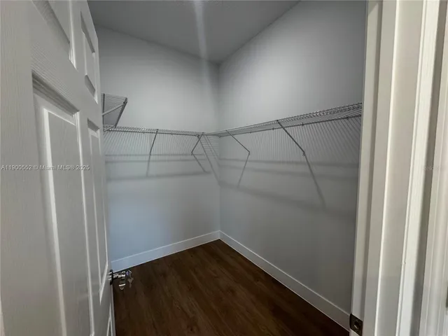 a view of a swimming pool with a yard