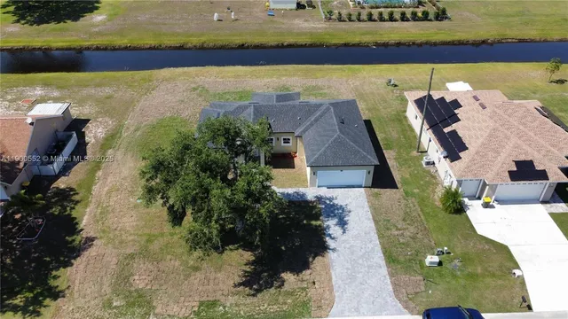 a view of a swimming pool with a yard